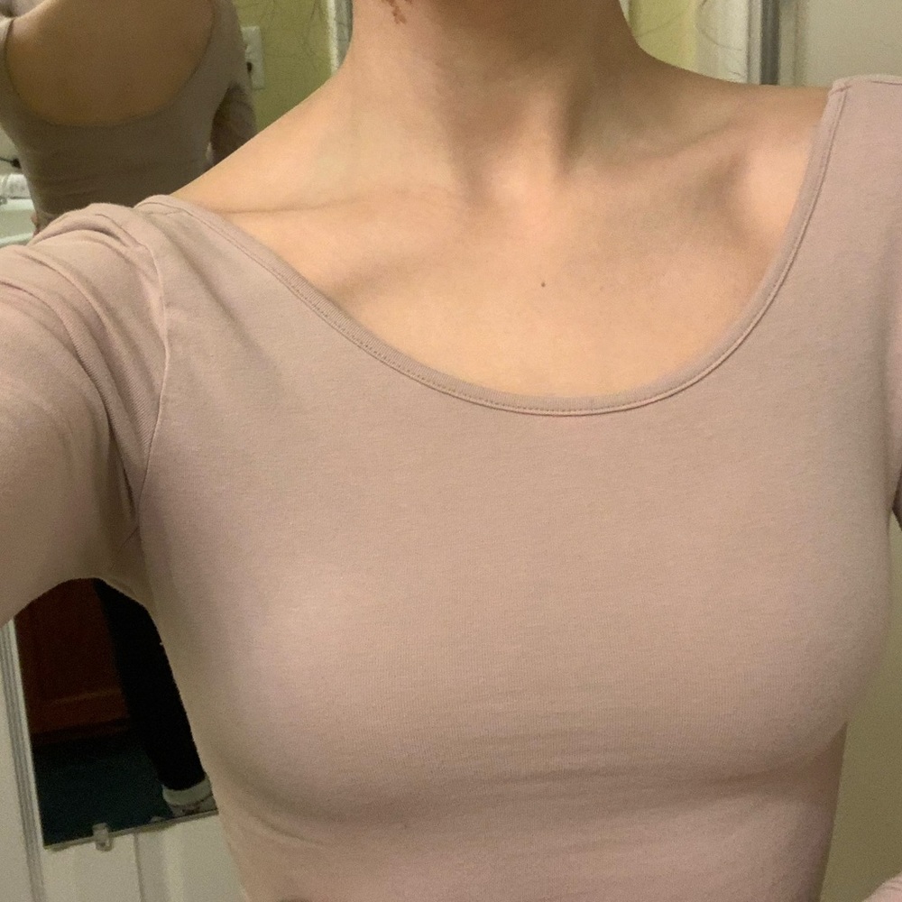 Tight, light pink shirt